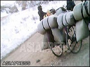 Bags filled with food on the bicycles of tegori merchants. Sometime a bicycle piles up more than 80 kilograms (=176 lb) of food or goods. (March, 2011. North Pyongan Province; Taken by Kim Dong-cheol) (C)ASIAPRESS 