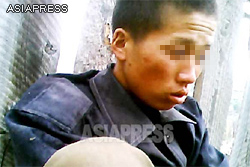 A low-ranking soldier, who appears to be in his early 20s, explained that his uniform was stolen by his superiors. As a result, he had to ask at a citizen's house to borrow some clothes. He confessed he was hungry and asked a reporting partner for something to eat. (June. 2013)