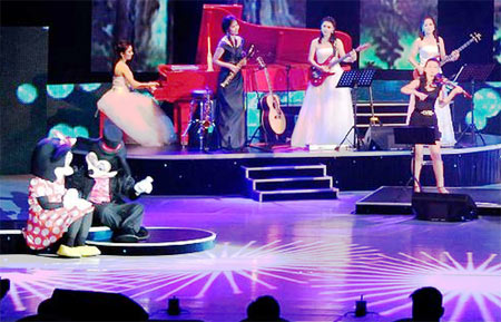 Mickey Mouse and Minnie on the stage at the Moranbong band show. The band is composed of young women. It is said the band was newly formed under the considerable prodding of Kim Jong-un. Among the songs to garner applause from the Dear Comrade, were some American songs performed by mini-skirt clad singers. (June.2012 PHOTO: KCNA)