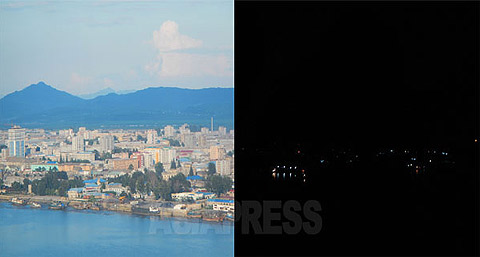 	 A picture of the Sinuiju city, North Korea's northern border town facing China. The left is the day-time and the right is the scene of the night. The picture was taken from the same position in China. Sinuiju has a prioritized power supply status, but lights could be seen sparsely in the night. (August/2015. Taken by ISHIMARU Jiro) ASIAPRESS