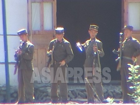 Border guards are on the lookout for smuggling and defection. Border guards checking their equipment prior to their rotation. Taken on August 2004 at Chinese side of upper Tumen River. (ASIAPRESS)