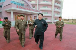 Kim Jong-un inspecting the newly established large-scale orphanage while smoking a cigarette. Quoted from “Rodong Sinmun”, a propaganda outlet of North Korea on January 2015