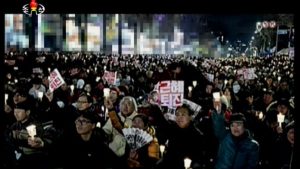 N. Korean TV pixelates the image of the protest against Park Geun-hye. What do they want to hide?